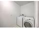 Well-lit laundry room featuring a washer and dryer, and clean white walls at 2028 Prospect Hill Dr, Mount Pleasant, SC 29464