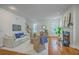 Inviting living room features hardwood floors, a cozy fireplace, and plenty of natural light at 2028 Prospect Hill Dr, Mount Pleasant, SC 29464