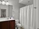 Cozy bathroom with a shower and tub combination, a white shower curtain, and a small vanity at 2064 Promenade Ct, Mount Pleasant, SC 29466