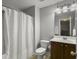 Standard bathroom with a shower and tub combination, a white shower curtain, and a dark vanity at 2064 Promenade Ct, Mount Pleasant, SC 29466