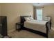 Bedroom with queen bed, side table, TV, and a large window offering plenty of natural light at 2064 Promenade Ct, Mount Pleasant, SC 29466