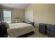 Bedroom with queen bed, storage bins, and a large window offering ample amounts of natural light at 2064 Promenade Ct, Mount Pleasant, SC 29466
