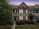 Charming townhome featuring a landscaped front yard, welcoming entrance, and neutral color scheme at 2064 Promenade Ct, Mount Pleasant, SC 29466