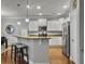 Bright kitchen with granite countertops, stainless steel appliances, and a breakfast bar with stylish stools at 2064 Promenade Ct, Mount Pleasant, SC 29466