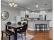Spacious kitchen with stainless steel appliances, granite countertops, and adjacent dining area at 2064 Promenade Ct, Mount Pleasant, SC 29466
