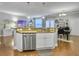 Open kitchen design with a granite breakfast bar overlooking the living space at 2064 Promenade Ct, Mount Pleasant, SC 29466