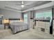 Cozy main bedroom with tray ceiling, carpet, and storage; the room is bathed in natural light at 2064 Promenade Ct, Mount Pleasant, SC 29466