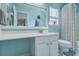 Bathroom features a large mirror over the vanity, a modern toilet, and a shower at 210 Delafield Dr, Summerville, SC 29483