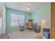 Well-lit bedroom featuring neutral carpet, a ceiling fan, and a desk at 210 Delafield Dr, Summerville, SC 29483