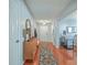 Welcoming entryway with hardwood floors, dresser, and stylish decor at 210 Delafield Dr, Summerville, SC 29483