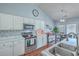 Bright kitchen featuring stainless steel appliances, marble countertops, and stylish backsplash at 210 Delafield Dr, Summerville, SC 29483