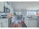 Modern kitchen with stainless steel appliances, tiled backsplash, and view to the dining area at 210 Delafield Dr, Summerville, SC 29483