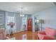 Cozy living room featuring hardwood floors, light blue walls, and natural light at 210 Delafield Dr, Summerville, SC 29483