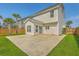 Backyard showing the home's rear exterior, a spacious patio, and lush lawn at 211 Saxony Loop, Summerville, SC 29486