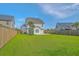 Spacious backyard with grass, fencing, and a view of the back of the house at 211 Saxony Loop, Summerville, SC 29486
