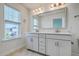 Bathroom featuring a double vanity, tile floors, and bright natural lighting at 211 Saxony Loop, Summerville, SC 29486