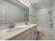 Bathroom with a double vanity, white countertops, tile floors, and shower and tub at 211 Saxony Loop, Summerville, SC 29486