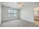 Bright bedroom with a ceiling fan, window with blinds, and gray carpet flooring at 211 Saxony Loop, Summerville, SC 29486