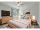 Stylishly decorated bedroom with a gray bed set, dresser and night stand decor, and an area rug at 211 Saxony Loop, Summerville, SC 29486