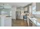 Updated kitchen with stainless steel appliances, granite countertops, and hardwood floors at 211 Saxony Loop, Summerville, SC 29486