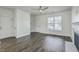 Spacious living room showcasing hardwood floors, a fireplace, and ample natural light at 211 Saxony Loop, Summerville, SC 29486