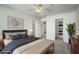 This staged main bedroom features an ensuite bathroom and walk-in closet at 211 Saxony Loop, Summerville, SC 29486