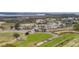 View of the community's golf course and clubhouse, surrounded by lush greenery at 2267 N Marsh Dr, Mount Pleasant, SC 29466