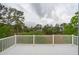 Back deck offering scenic views of lush trees and tranquil wetlands at 2267 N Marsh Dr, Mount Pleasant, SC 29466