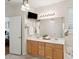 Bright bathroom with double sinks, vanity, tile floors, and large mirror at 2267 N Marsh Dr, Mount Pleasant, SC 29466