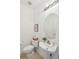 Cozy half bathroom with a pedestal sink and neutral decor for a clean look at 2267 N Marsh Dr, Mount Pleasant, SC 29466
