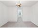 Neutral bedroom with a chandelier, white walls and trim, and views to an adjacent room at 2267 N Marsh Dr, Mount Pleasant, SC 29466