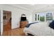 Comfortable bedroom with wood floors and a view to the kitchen and street at 2267 N Marsh Dr, Mount Pleasant, SC 29466