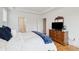 Bedroom with natural lighting with hardwood floor and view to the Primary bath at 2267 N Marsh Dr, Mount Pleasant, SC 29466