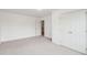 Bedroom featuring neutral carpet and white walls and trim, with a double closet at 2267 N Marsh Dr, Mount Pleasant, SC 29466