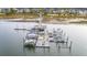 Aerial view of a community boat dock filled with boats on calm waters at 2267 N Marsh Dr, Mount Pleasant, SC 29466