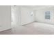 A large bonus room featuring an oval window and neutral carpet at 2267 N Marsh Dr, Mount Pleasant, SC 29466