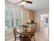 Bright breakfast nook featuring plantation shutters, kitchenette, and round wooden table at 2267 N Marsh Dr, Mount Pleasant, SC 29466