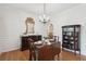 Bright dining room featuring hardwood floors, classic furnishings, and stylish lighting at 2267 N Marsh Dr, Mount Pleasant, SC 29466