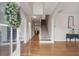 Elegant foyer with gleaming hardwood floors, a staircase, and classic decor at 2267 N Marsh Dr, Mount Pleasant, SC 29466