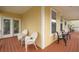 Expansive front porch provides ample seating with views of the surrounding neighborhood at 2267 N Marsh Dr, Mount Pleasant, SC 29466