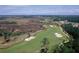An aerial view of the community golf course, with sand traps and a beautiful design at 2267 N Marsh Dr, Mount Pleasant, SC 29466