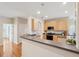 Bright kitchen with wood cabinets, stainless appliances, breakfast bar, and easy access to dining and entry at 2267 N Marsh Dr, Mount Pleasant, SC 29466