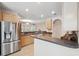 Well-lit kitchen featuring stainless steel appliances, wooden cabinets, and a convenient breakfast bar area at 2267 N Marsh Dr, Mount Pleasant, SC 29466