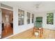 Sunny sunroom with wood floors, bright windows, and an exit to the outdoor area at 2267 N Marsh Dr, Mount Pleasant, SC 29466