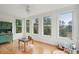 Sunroom filled with light, featuring hardwood floors and an outdoor view at 2267 N Marsh Dr, Mount Pleasant, SC 29466