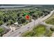 Aerial view of the property showcasing the surrounding greenery, proximity to the road and nearby body of water at 2373 Sorentrue Ave, North Charleston, SC 29405