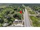 Property with a location near the road and surrounded by mature trees, as seen in this aerial view at 2373 Sorentrue Ave, North Charleston, SC 29405