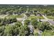 Aerial view of neighborhood with trees and roads throughout with a variety of homes at 2373 Sorentrue Ave, North Charleston, SC 29405