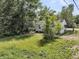View of the home with a spacious backyard, ideal for outdoor activities and gardening at 2373 Sorentrue Ave, North Charleston, SC 29405