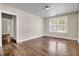 Bedroom featuring hardwood floors, crisp white trim, and a large window for ample natural light at 2373 Sorentrue Ave, North Charleston, SC 29405